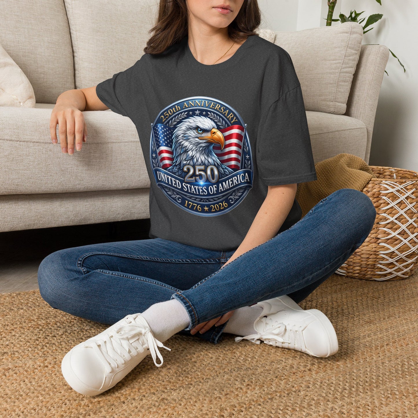 250th anniversary eagle design on a dark gray t-shirt, worn by a woman sitting on the floor